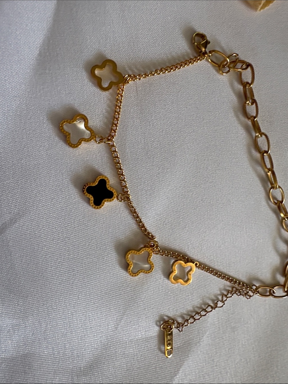 Copy Louis Vuitton Gold-Tone Clover Charm Bracelet with Black and White Accents